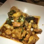 A rice cake and seafood mixture.