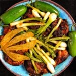 Spiced chicken with onion and jalapeno. peppers.