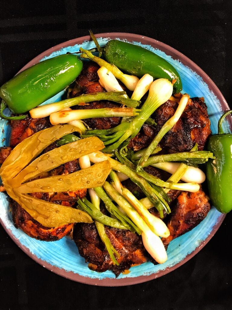 Spiced chicken with onion and jalapeno. peppers.