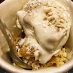 Bourbon ice cream in a bowl with a spoon.
