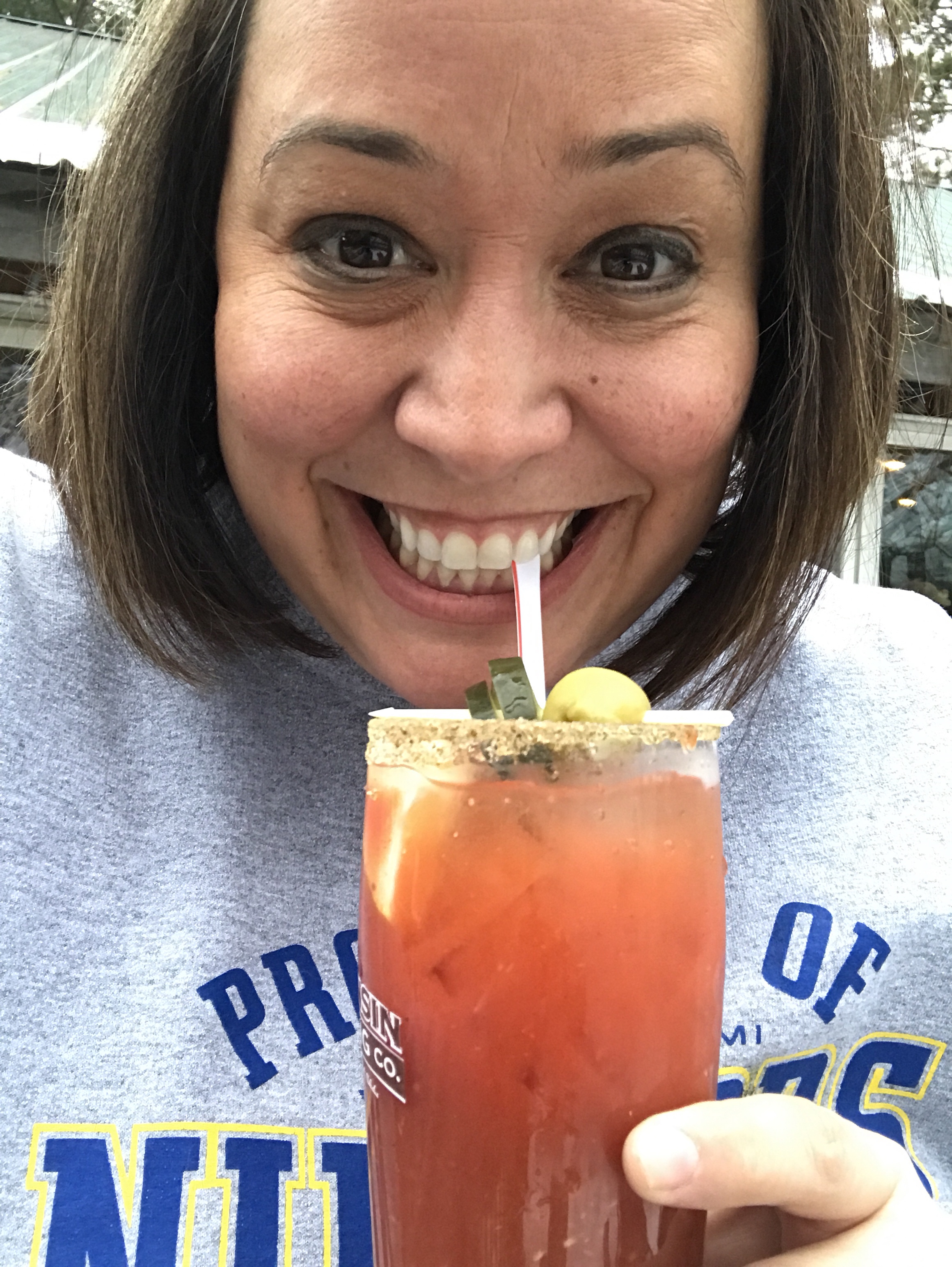 Me with a Bloody Mary, the straw between my teeth.