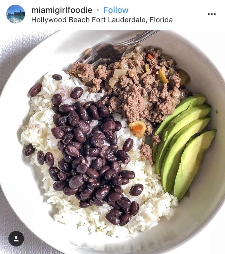 An Instagram post from miamigirlfoodie in Hollywood Beach Fort Laurdale, Florida. It features ground meat, avocado, rice, and beans. 