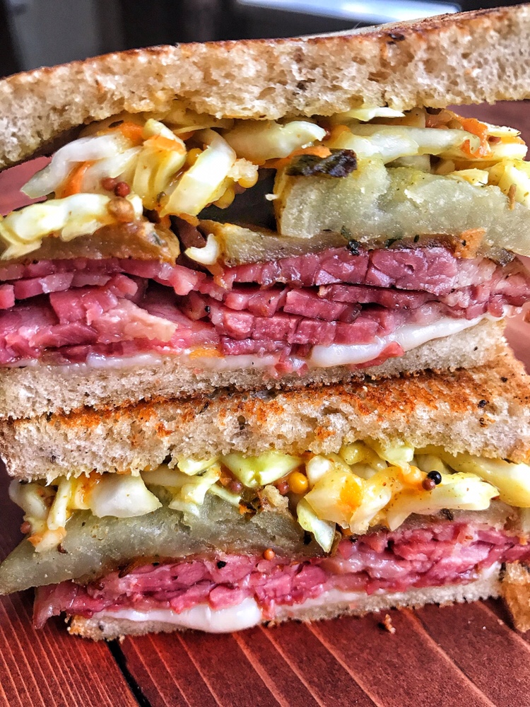 A sliced corned beef sandwich.