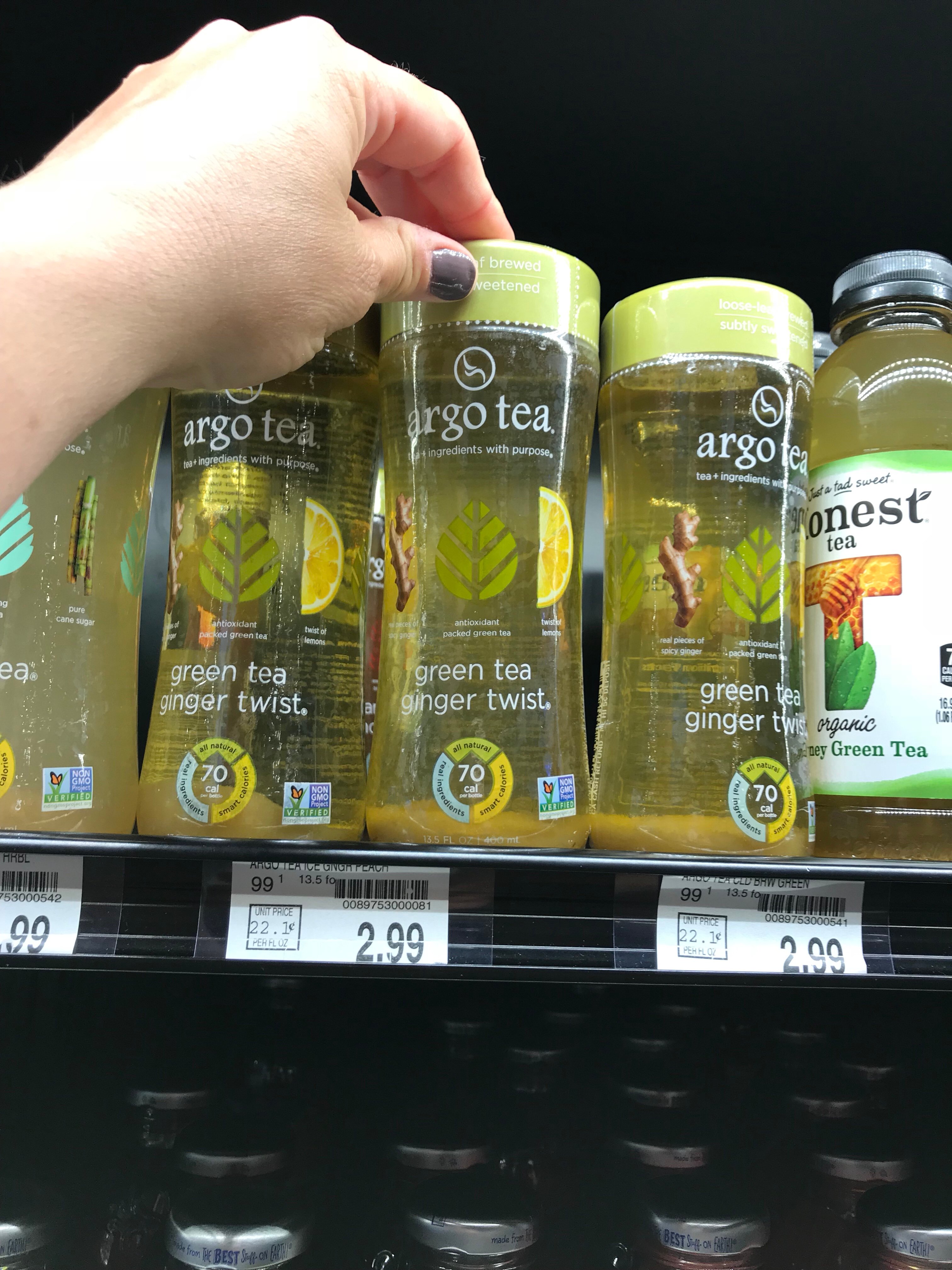 A point of view shot of me taking a "green tea ginger twist" Argo Tea off the shelf.