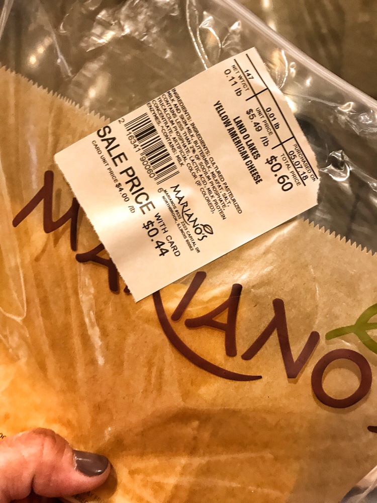 A package of sliced Yellow American Cheese.
