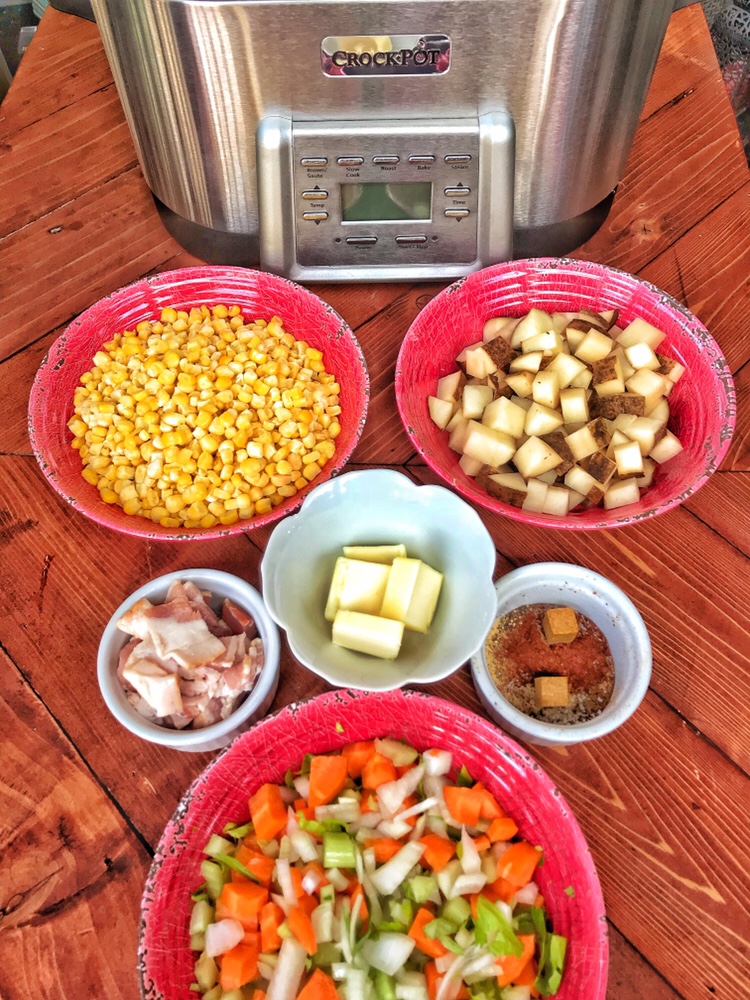 The ingredients for the Crockpot Corn Chowder in bowls in front of the Crockpot.