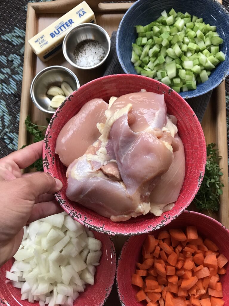 Raw boneless, skinless chicken thighs.