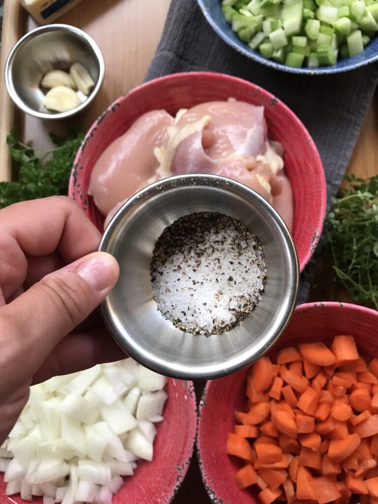 Salt and pepper in a meta cup.