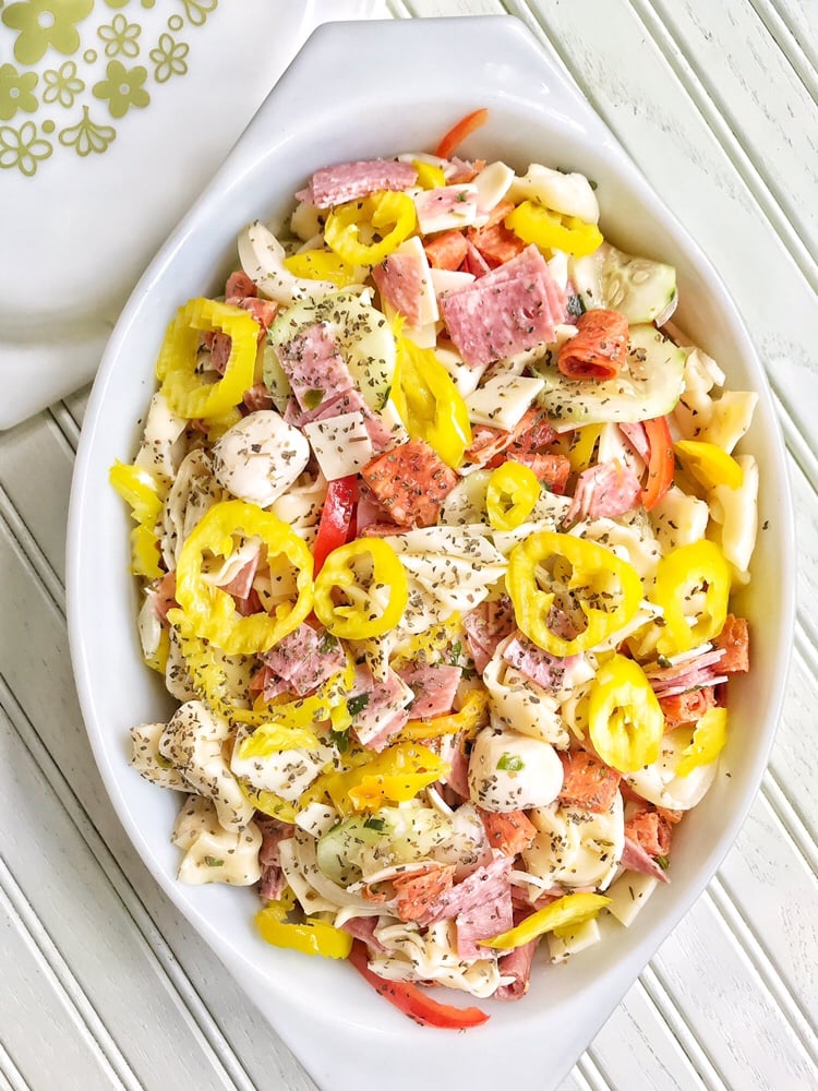 Italian Sub Tortellini Salad in an white, oval dish.