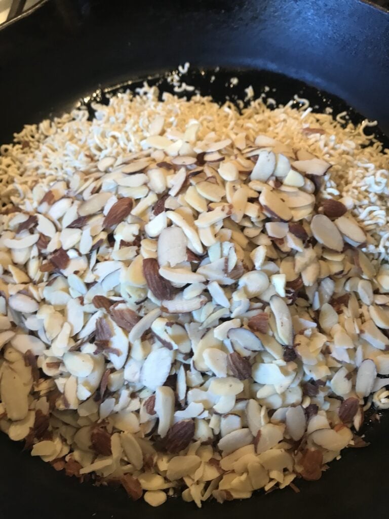 Noodles and almonds in the pan