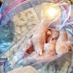 Raw chicken tenders in a Ziploc bag.