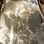 An oiled foil covered cookie sheet.