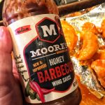 A bottle of Moore's honey barbecue sauce.