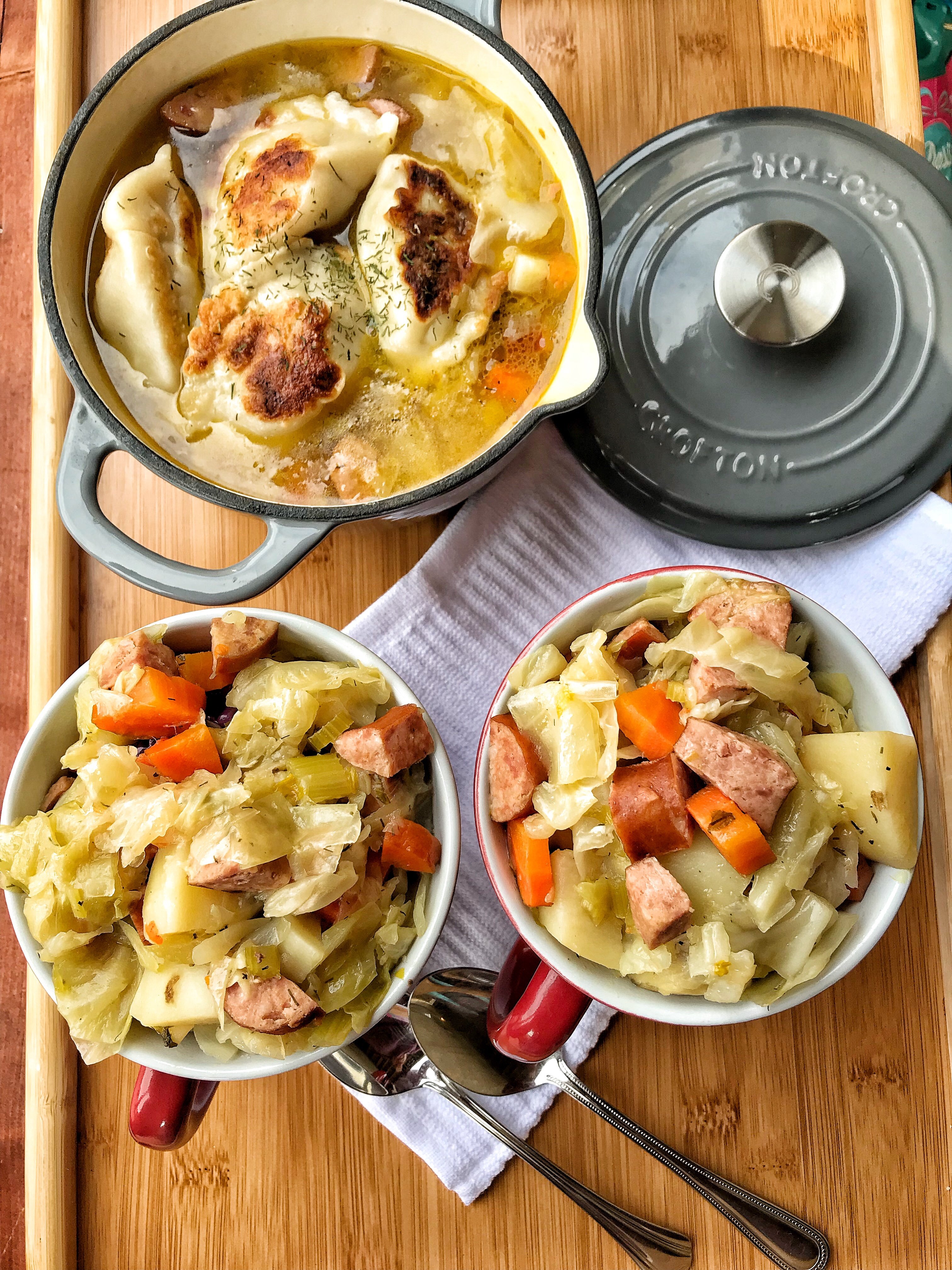 Two bowls of pierogi soup with sausage