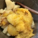 The butter being mixed into the squash
