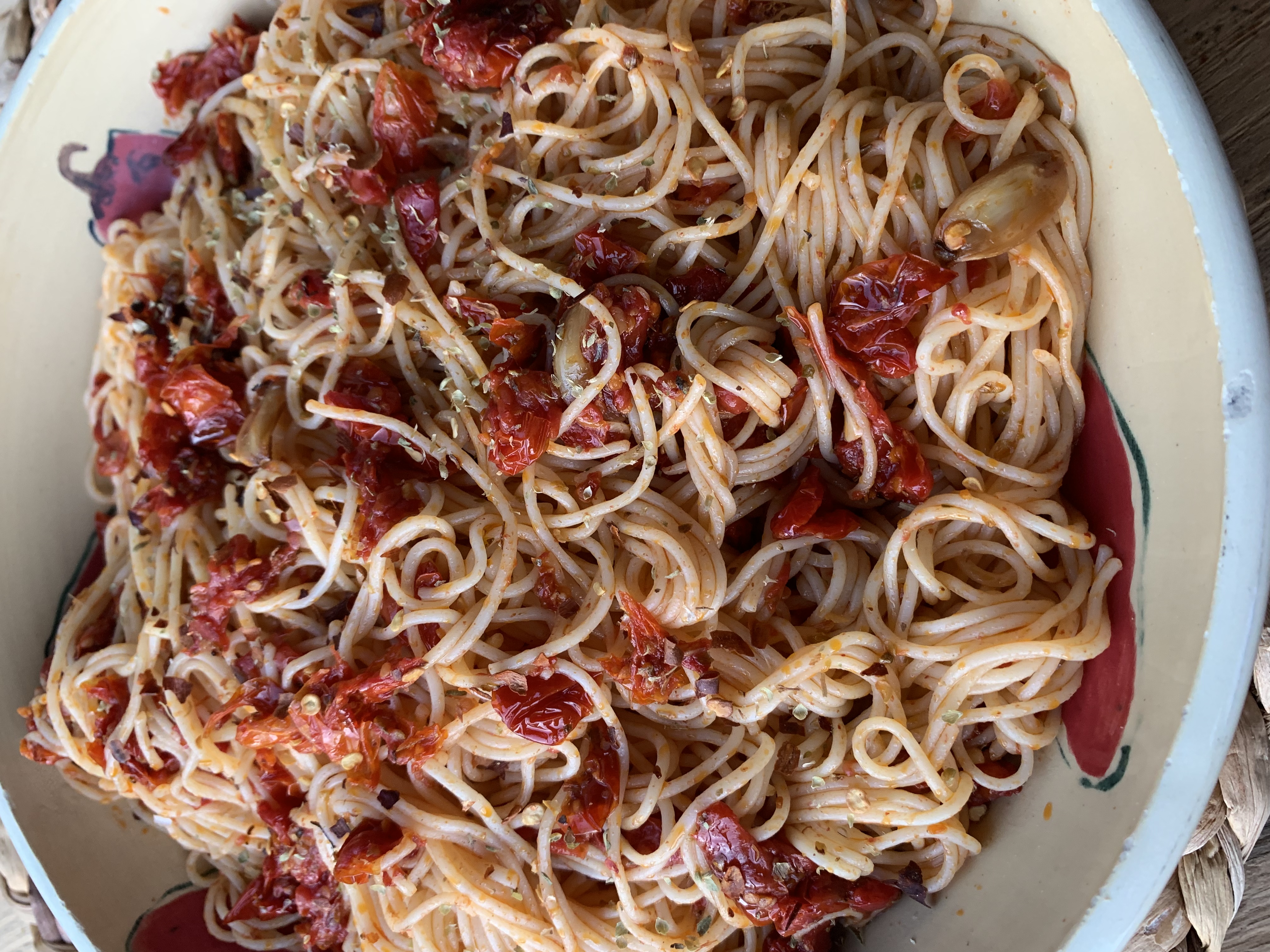 A bowl of tomato pasta.