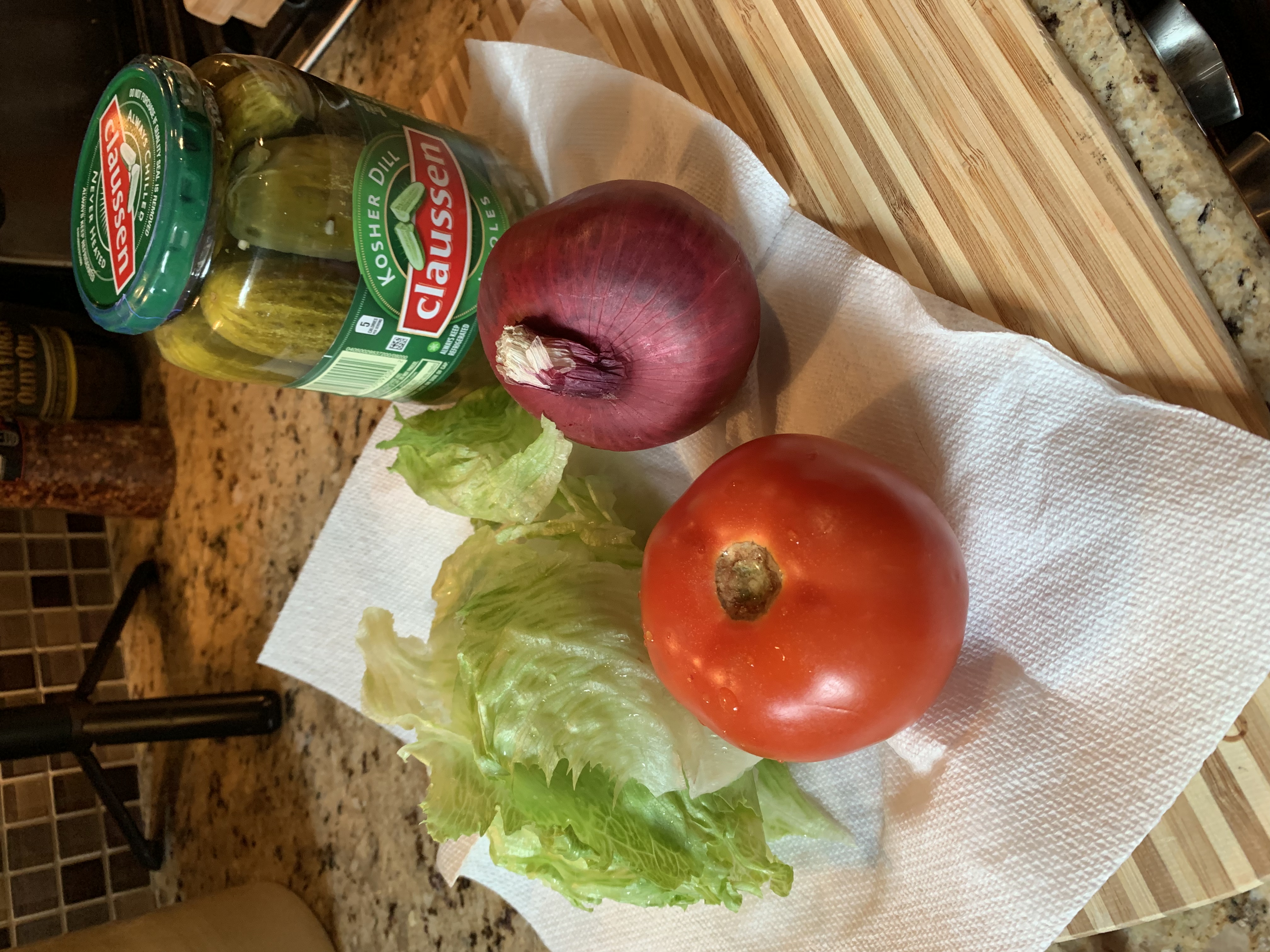Tomato, lettuce, red onion, and pickles