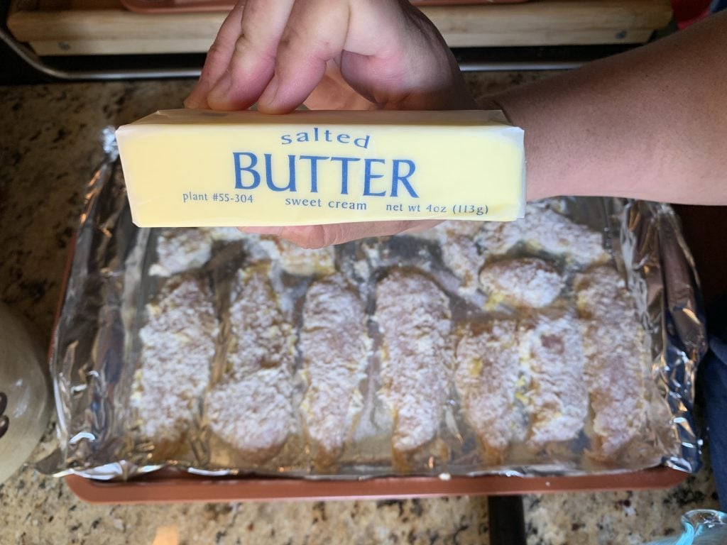 A stick of butter over the battered chicken tenders