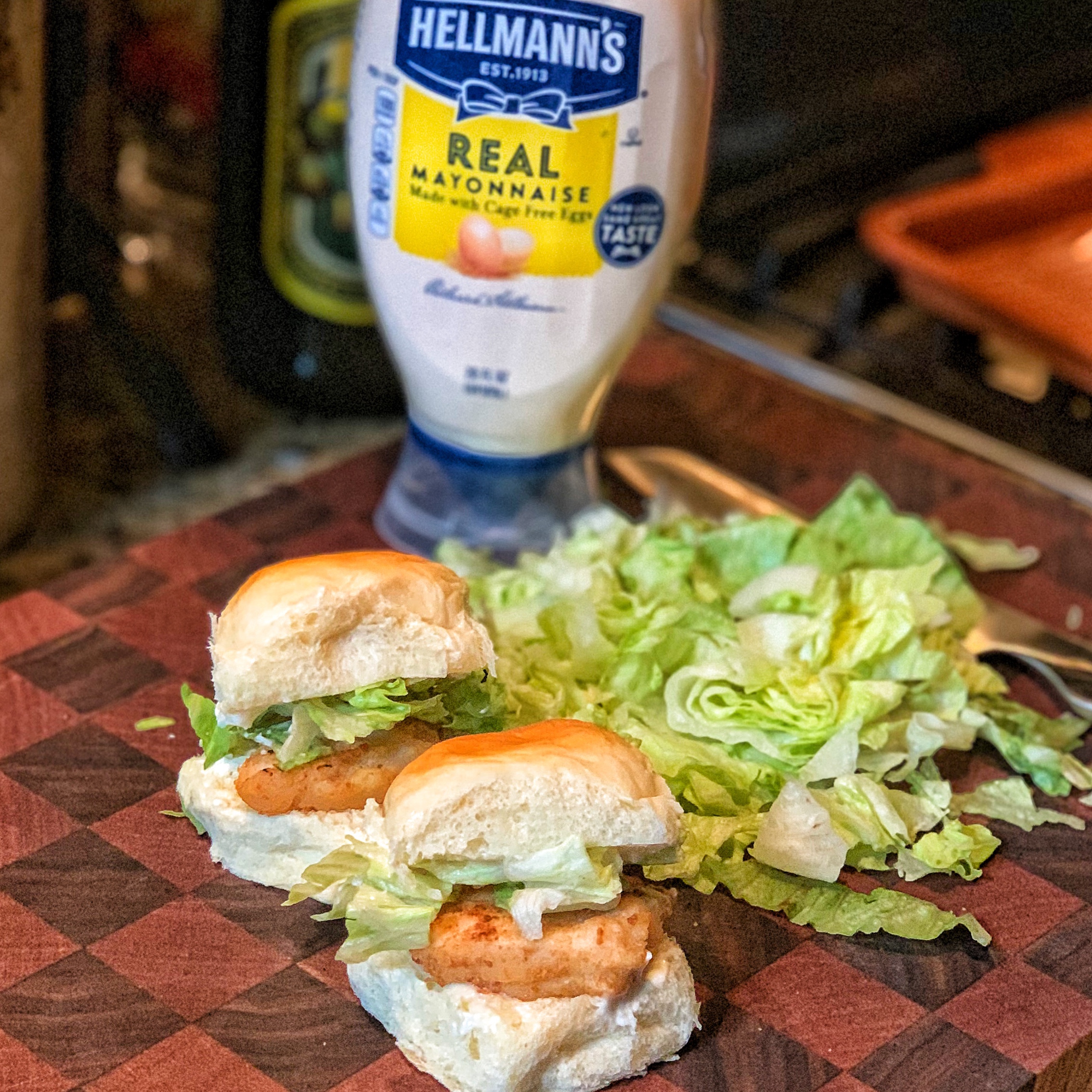 Two sliders with a bottle of Hellmann's mayo