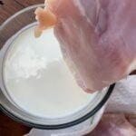 Chicken about to be dipped in Greek yogurt