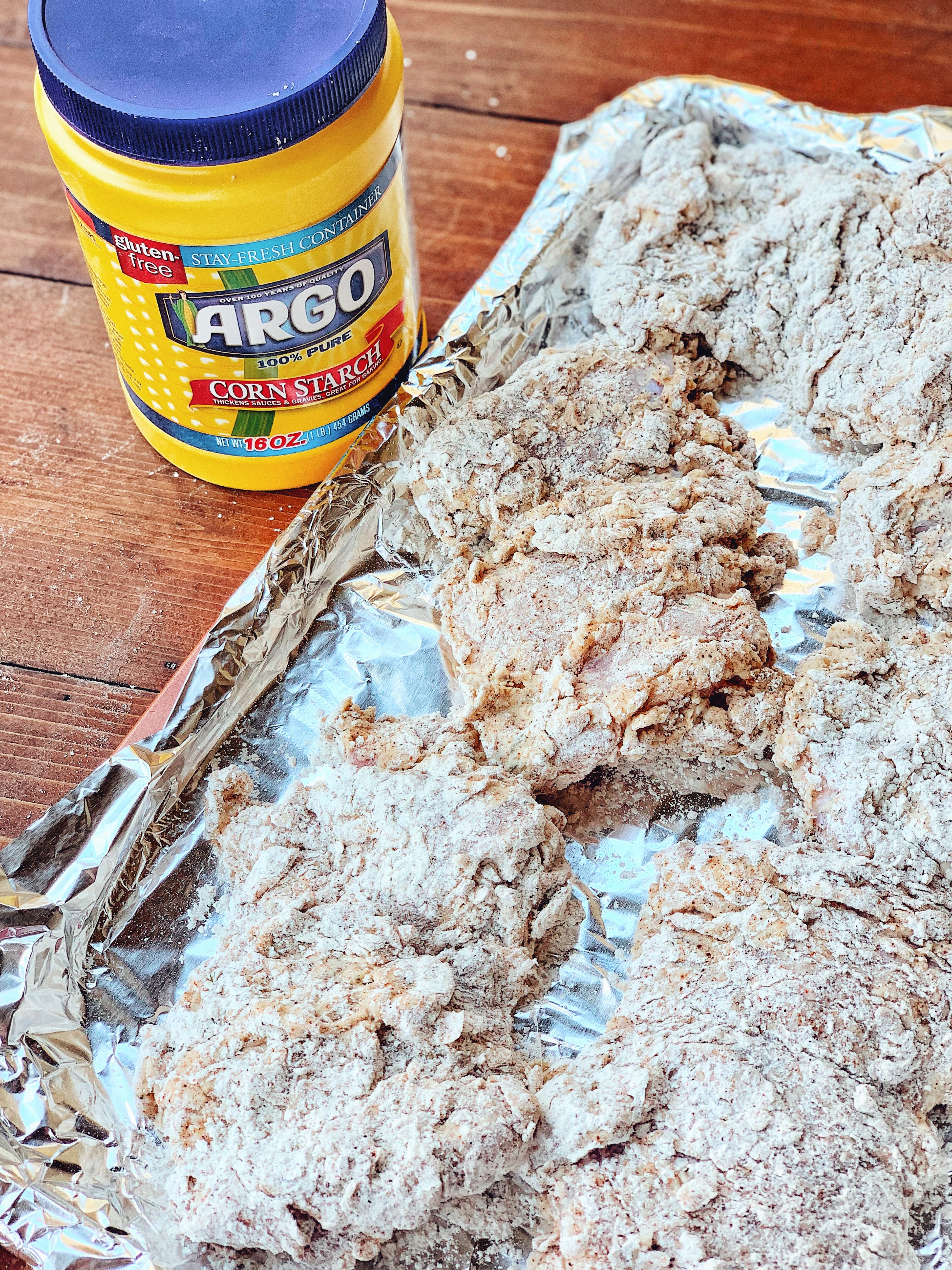 Chicken on a baking sheet before frying