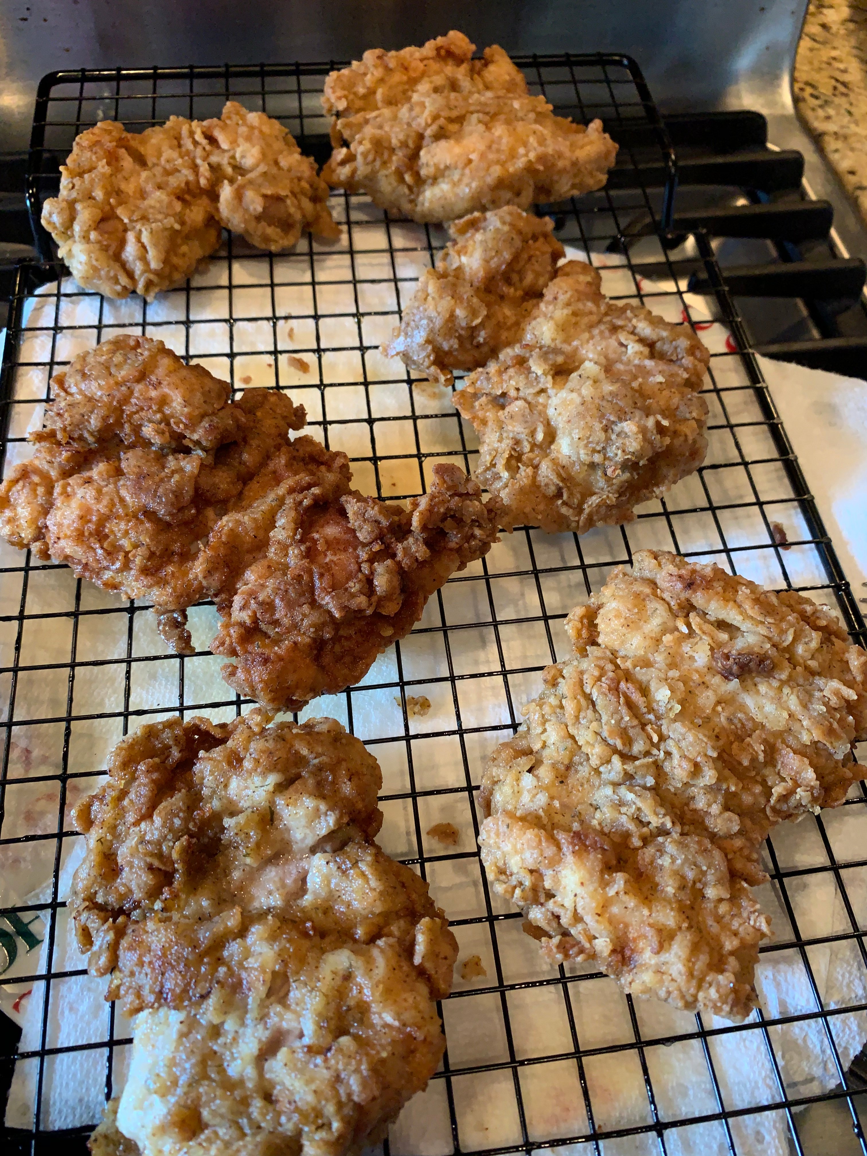 Fried chicken cooling on a rack