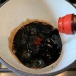 Soy sauce being added to a bowl