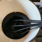 The glaze being whisked