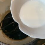 The corn starch mixture being poured into the glaze