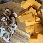 Sliced cheese and mushrooms