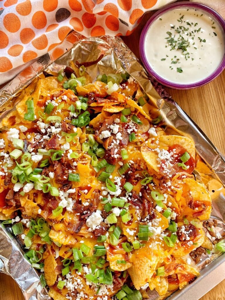 BBQ chips topped with cheese and served with ranch dressing