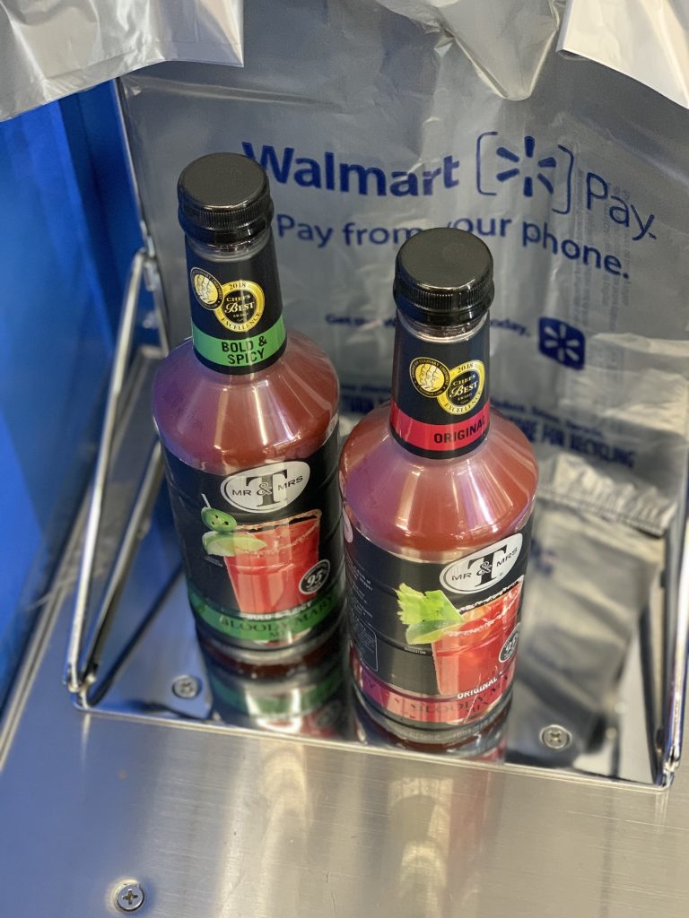 Two bottles of Bloody Mary mix in the Walmart checkout area