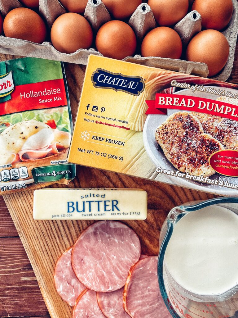 The ingredients for the casserole, including a Hollandaise sauce mix packet, bread dumplings, butter, ham, and milk