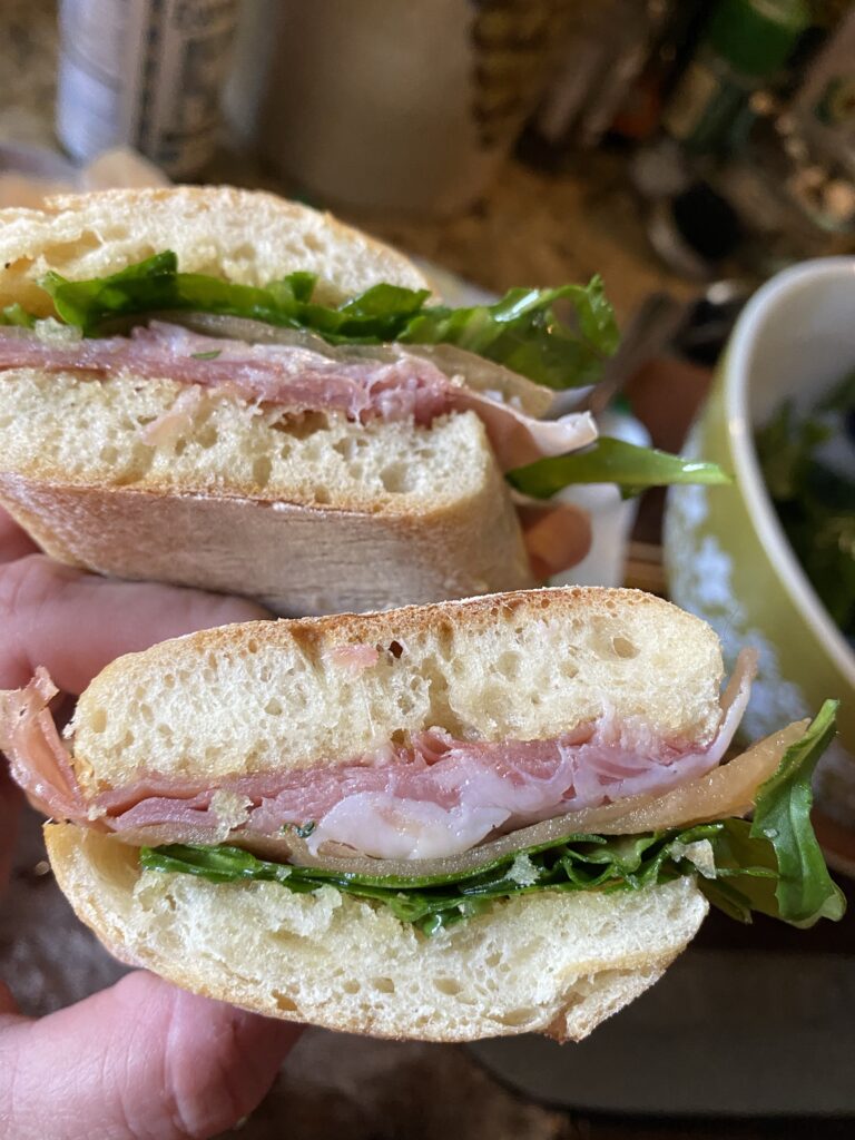 A close up of two halves of the Ultimate Picnic Sandwich