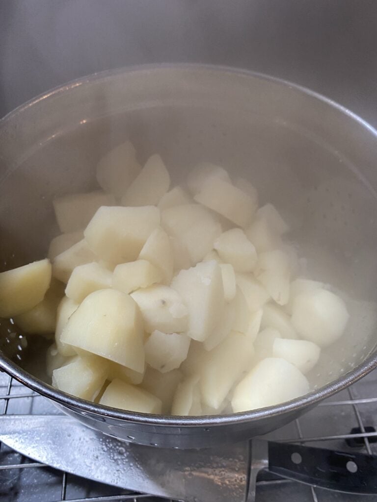 Boiled potatoes in a strainer
