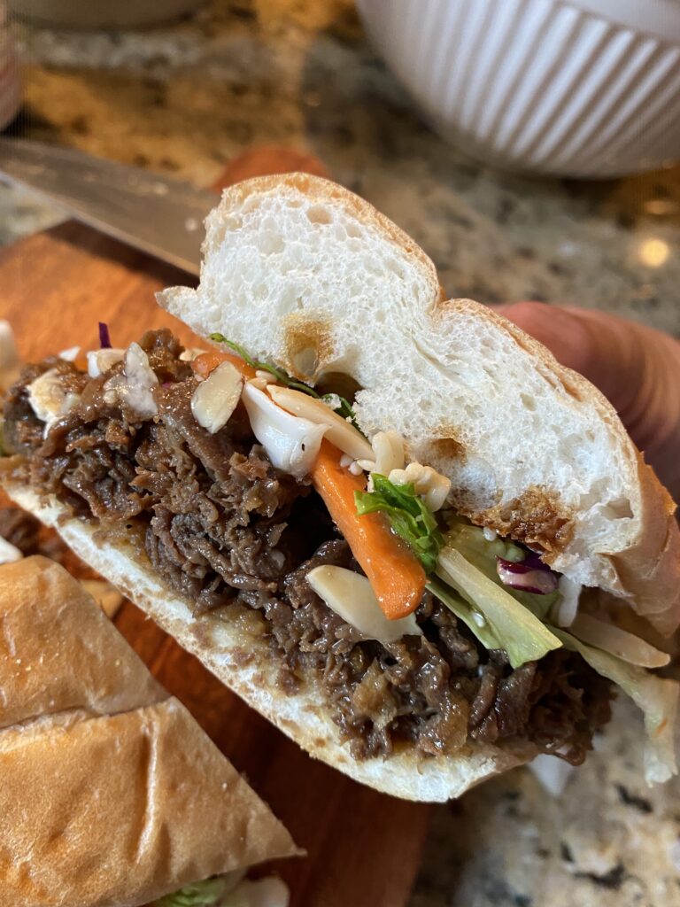A close up of half an Asian Steak Sub Sandwich