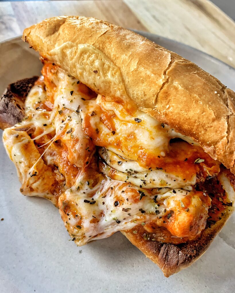 A chicken parm sub on a plate