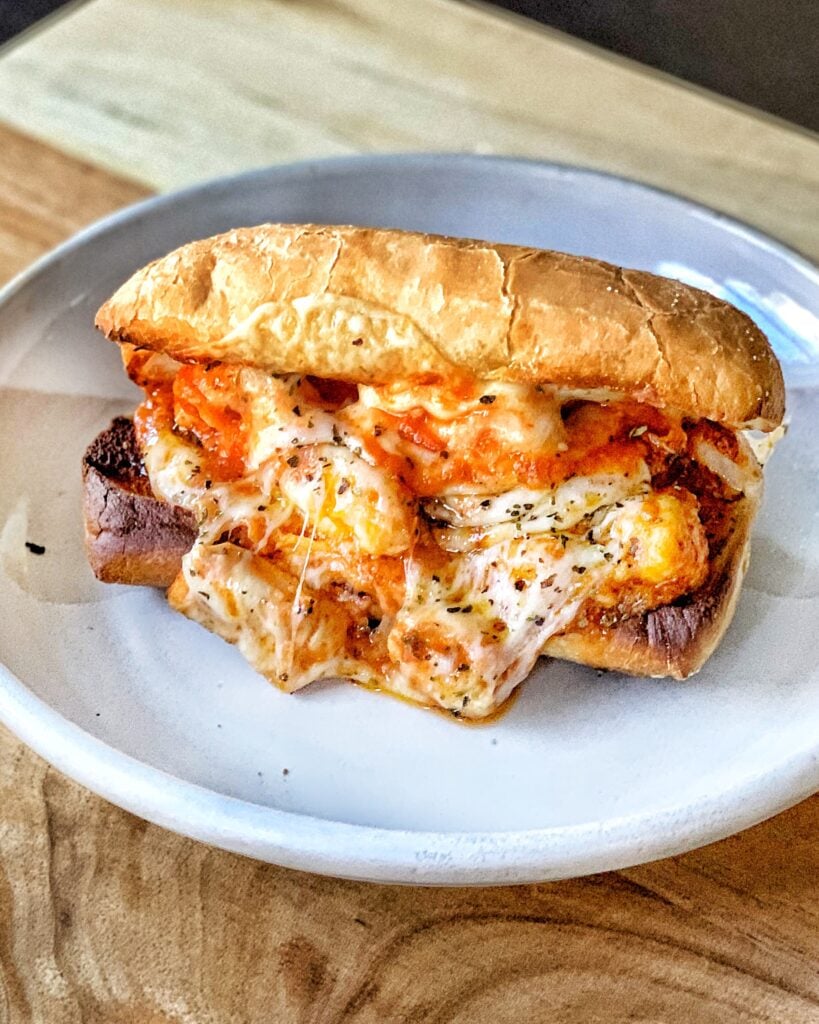 A chicken and parm sub on a plate