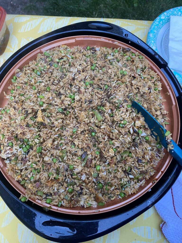 The Bacon and Onion fried rice with a blue spatula in it