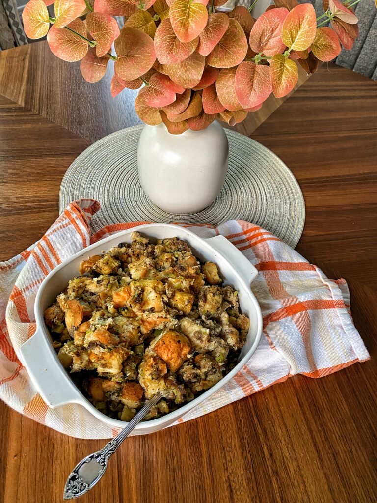 The stuffing on a table by a fall centerpiece