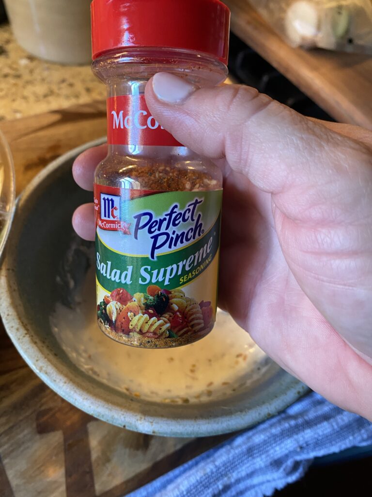A shaker of Salad Supreme Seasoning