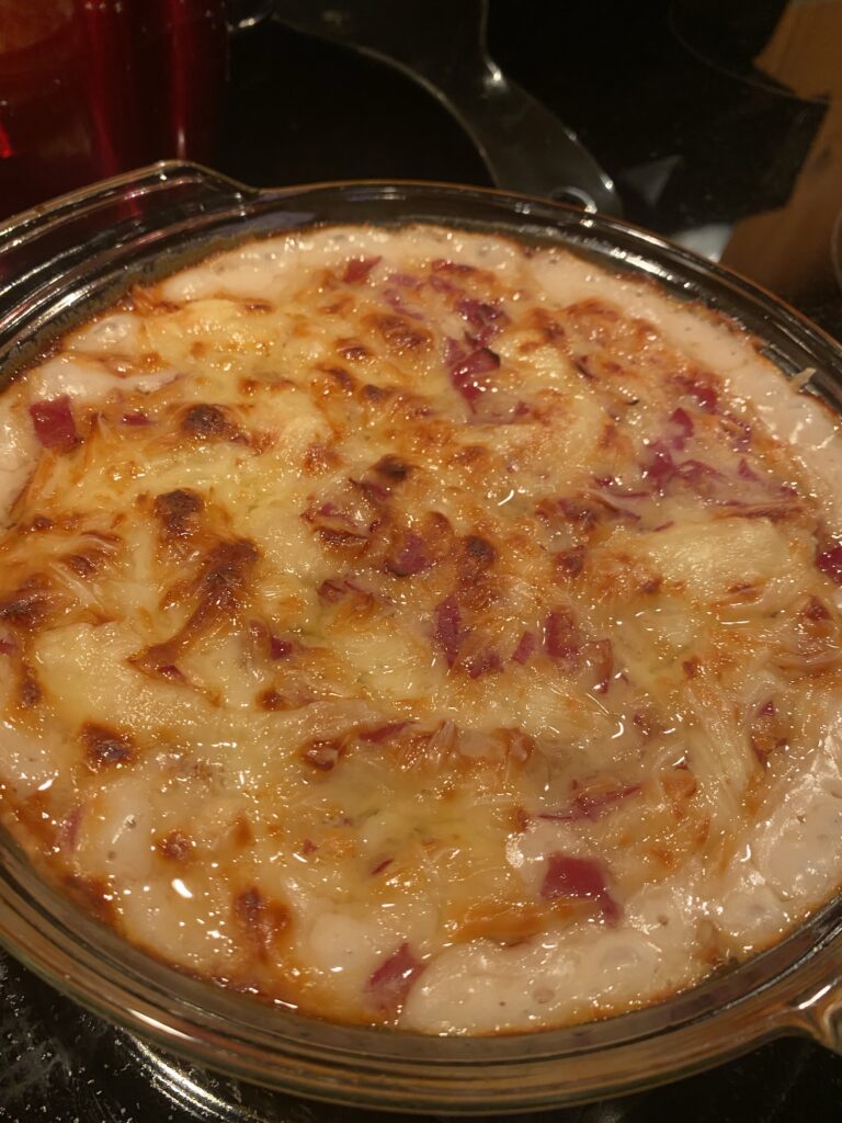 A close up of the baked reuben dip