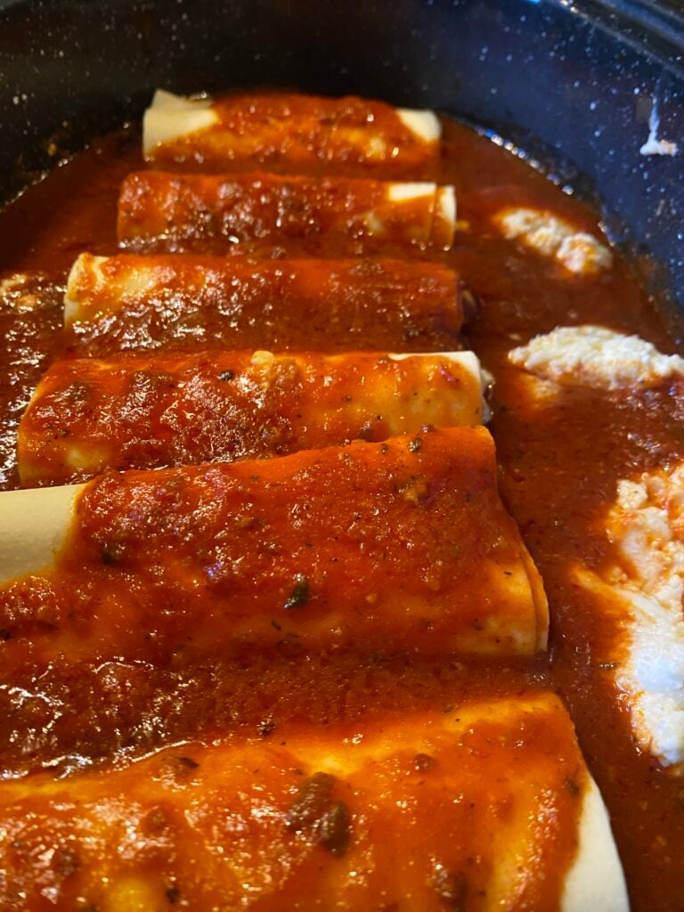 A close up of baked manicotti