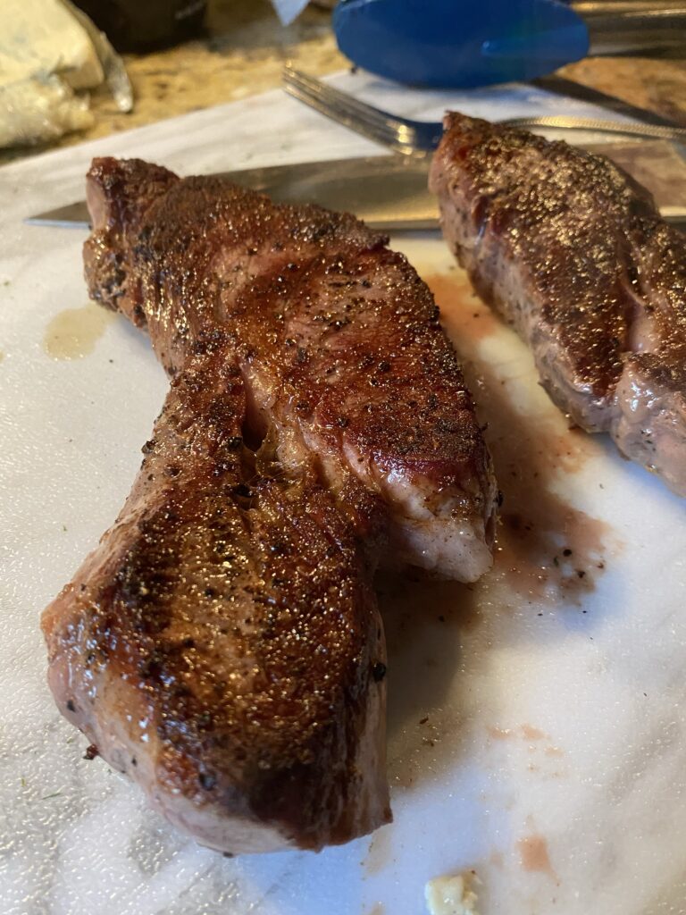 Cooked steak on a cutting board