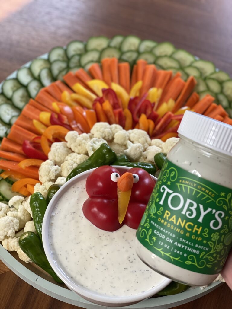 A close up of the finished veggie turkey next to a bowl and jar of ranch