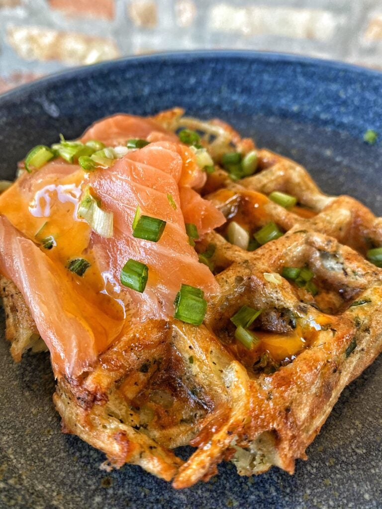A potato waffle topped with smoked salmon