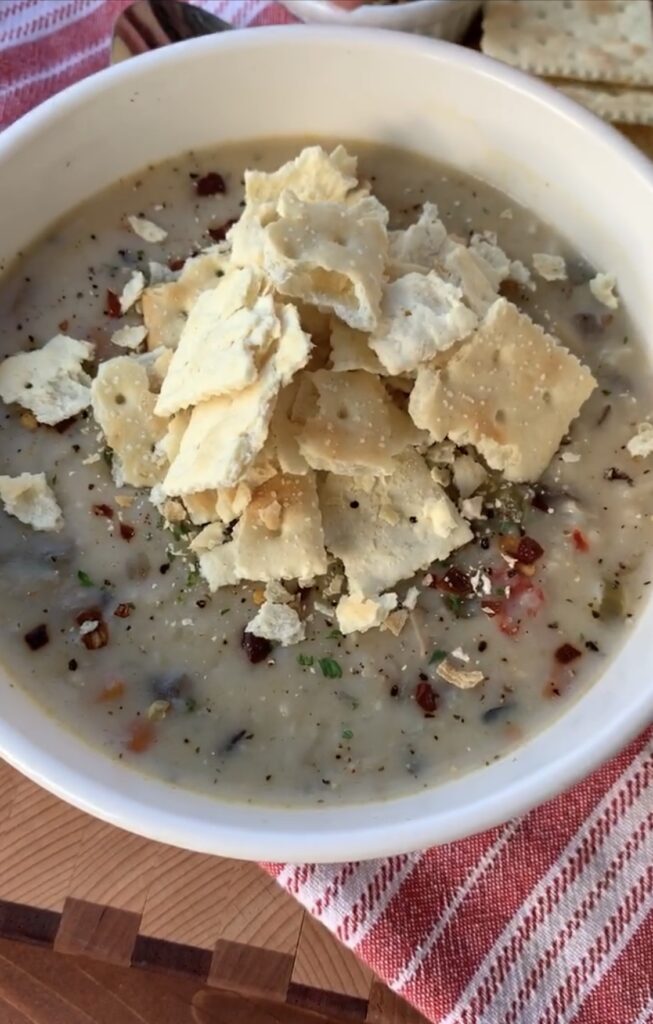 Crumbled Saltines over the finished Wild Rice Soup