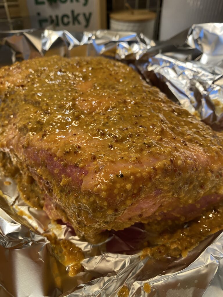 Corned beef brisket covered in mustard glaze