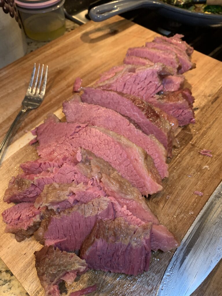 Slices of corned beef on a cutting board