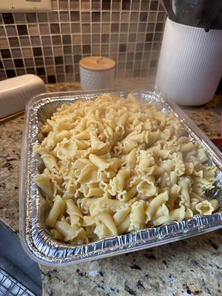 Buttered noodles in a baking tin